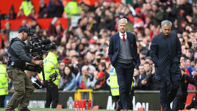 arsenal s french manager arsene wenger c and manchester united s portuguese manager jose mourinho r leave after the english premier league football match between manchester united and arsenal at old trafford in manchester north west england on april 29 2018 manchester united won the game 2 1 photo afp