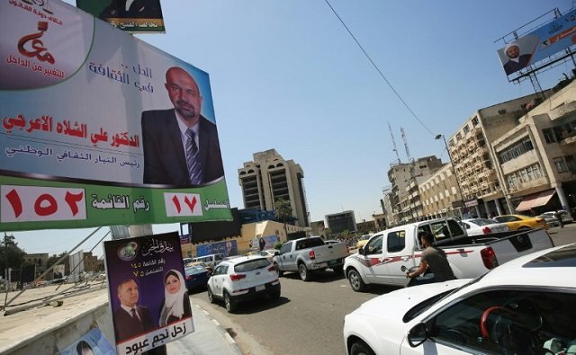 electoral posters line the side of the road in central baghdad ahead of iraq 039 s may 12 parliamentary elections photo afp