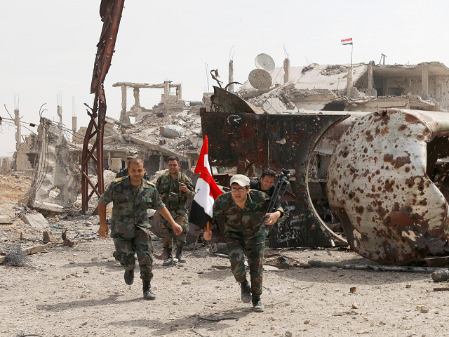 the syrian army s assault on the pocket between homs and hama included both air strikes and artillery photo reuters