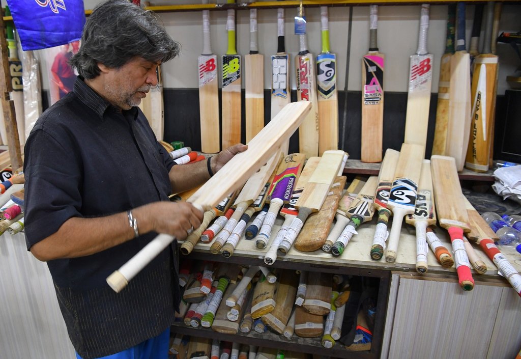 eye for detail indian bat maker aslam chaudhry checks a cricket bat at his workshop in mumbai photo afp