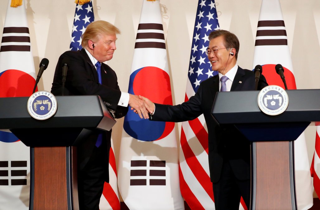 us president donald trump and south korea s president moon jae in shake hands during a news conference at south korea s presidential blue house in seoul south korea photo reuters