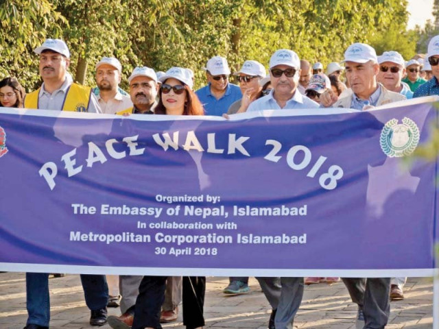mayor anser aziz and nepalese ambassador sewa adhikari walk with diplomats and citizens in f 9 park to mark the birth of gautam buddha photo express mayor anser aziz and nepalese ambassador sewa adhikari walk with diplomats and citizens in f 9 park to mark the birth of gautam buddha photo express