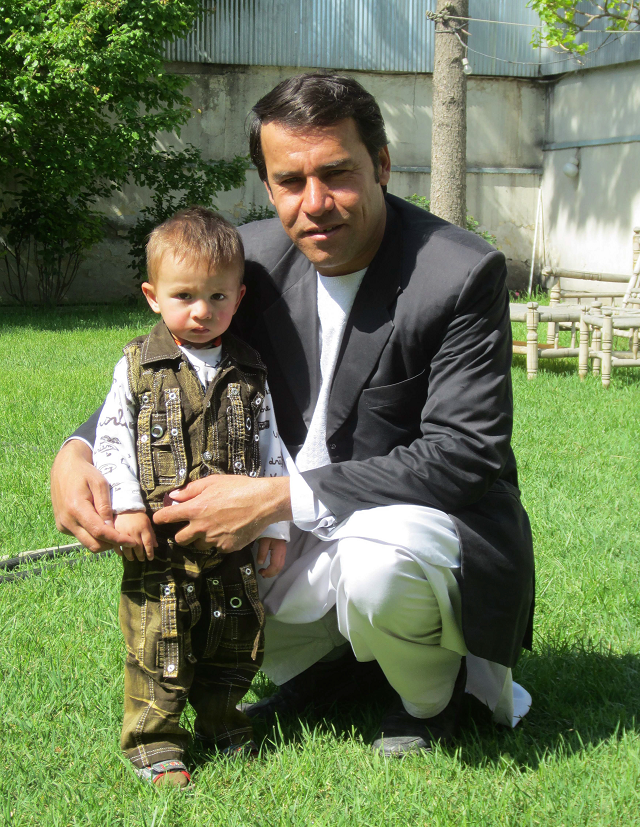 shah marai with one of his sons photo afp