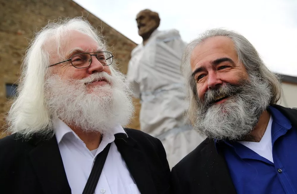 michael thielen and henning laufer two karl marx look alike men pose in front of a 4 4 metres 14 feet high bronze statue of marx created by chinese artist wu weishan and donated by china to the hometown of the german philosopher in trier germany photo reuters michael thielen and henning laufer two karl marx look alike men pose in front of a 4 4 metres 14 feet high bronze statue of marx created by chinese artist wu weishan and donated by china to the hometown of the german philosopher in trier germany photo reuters