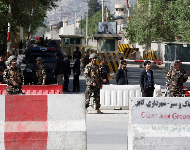 afghan security forces stand guard near the site of a blast in kabul afghanistan april 30 2018 photo reuters