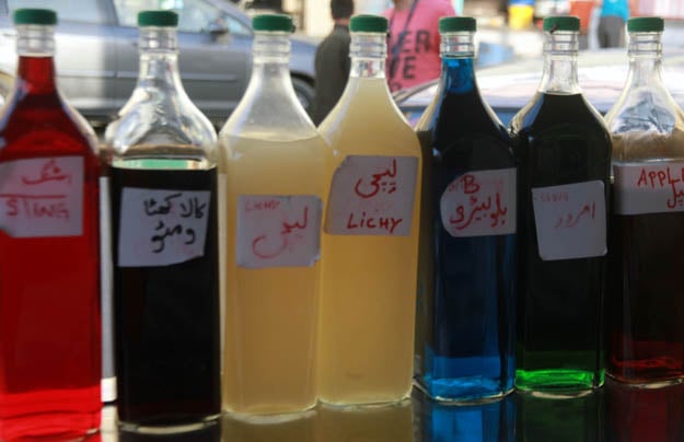 Different flavoured syrups are used to make gola ganda and some vendors claim to make them at home. PHOTO: ATHAR KHAN/EXPRESS