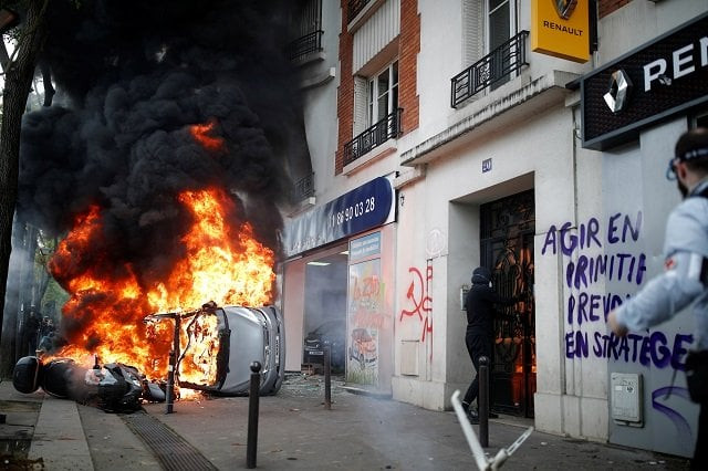 a car burns outside a renault automobile garage during clashes during the may day labour union march in paris france may 1 2018 photo reuters a car burns outside a renault automobile garage during clashes during the may day labour union march in paris france may 1 2018 photo reuters