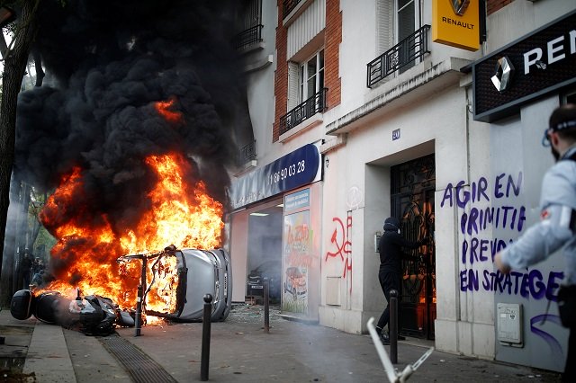 a car burns outside a renault automobile garage during clashes during the may day labour union march in paris france may 1 2018 photo reuters