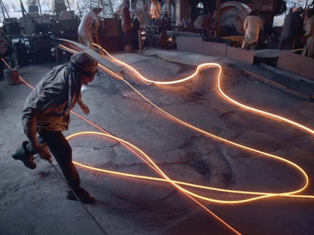 workers mould molten steel rods at a mill on international labour day in islamabad on may 1 photo afp workers mould molten steel rods at a mill on international labour day in islamabad on may 1 photo afp
