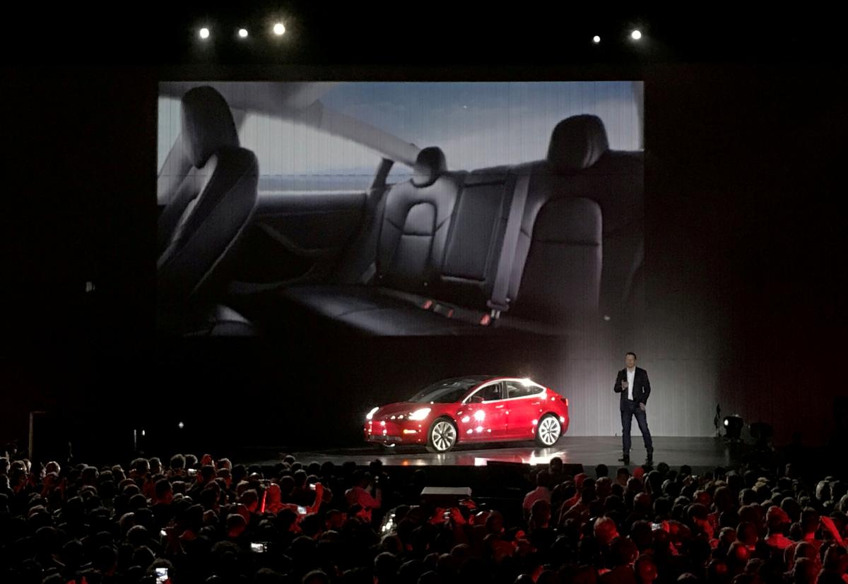 file photo elon musk introduces one of the first model 3 cars off the fremont factory 039 s production line during an event at the company 039 s facilities in fremont california photo reuters