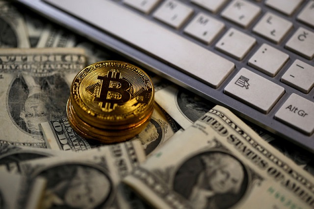 bitcoin virtual currency coins placed on dollar banknotes next to computer keyboard are seen in this illustration picture november 6 2017 photo reuters