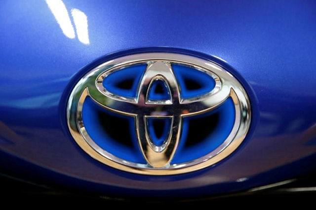 the toyota company logo is see on a yaris model car that is on display at toyota 039 s automobile manufacturing plant before the visit by the french president in onnaing france january 22 2018 photo reuters