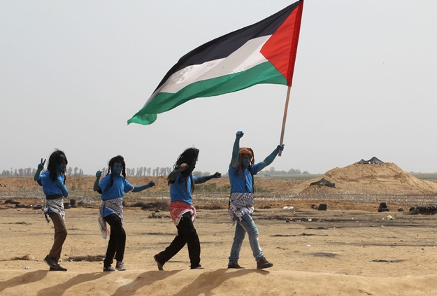 palestinians with their faces painted like characters from the movie quot avatar quot photo afp