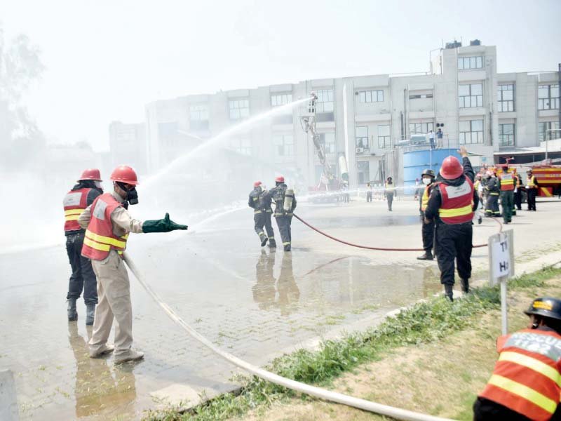 rescue 1122 personnel take part in a mock exercise in sialkot on the occasion of international firefighters day photo ppi