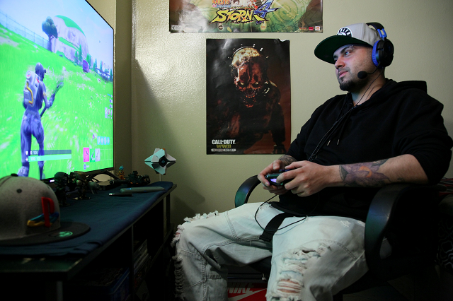 twenty seven year old christian acevedo plays the video game 039 fortnite battle royale 039 from his home in brooklyn new york us on april 29 2018 photo reuters twenty seven year old christian acevedo plays the video game 039 fortnite battle royale 039 from his home in brooklyn new york us on april 29 2018 photo reuters