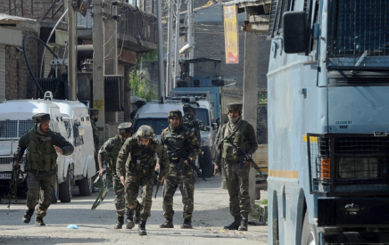 indian security personnel react during a gunbattle between security forces and suspected rebels in srinagar on may 5 2018 three suspected rebels and a civilian were killed may 5 in srinagar in indian administered kashmir during a gun battle police said photo afp