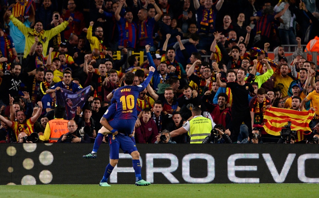 unbeaten season leo messi celebrates his vital goal against real madrid during the clasico photo afp