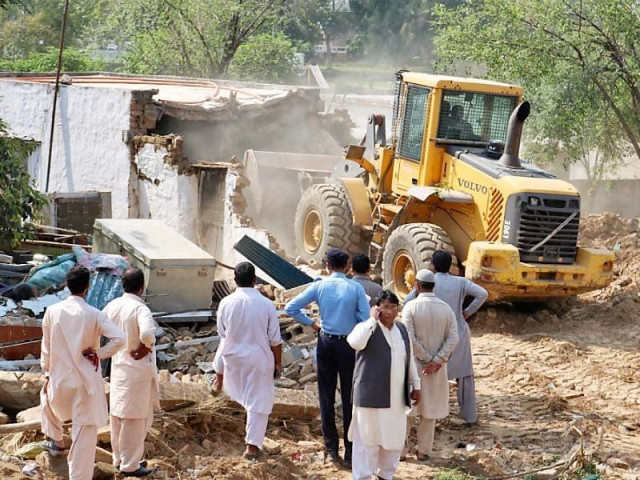 heavy machinery of the civic authority razes illegal structures set up in sector f 11 3 photo express heavy machinery of the civic authority razes illegal structures set up in sector f 11 3 photo express