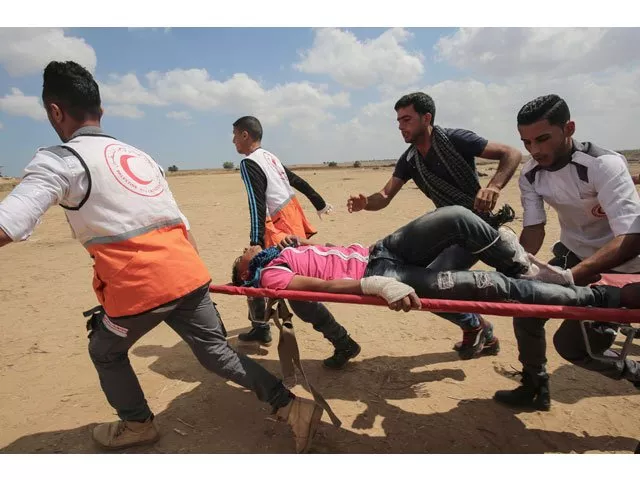 palestinians carry a protester injured during clashes with israeli forces along the border with the gaza strip east of khan yunis on may 14 2018 as palestinians protest over the inauguration of the us embassy following its controversial move to jerusalem photo afp palestinians carry a protester injured during clashes with israeli forces along the border with the gaza strip east of khan yunis on may 14 2018 as palestinians protest over the inauguration of the us embassy following its controversial move to jerusalem photo afp