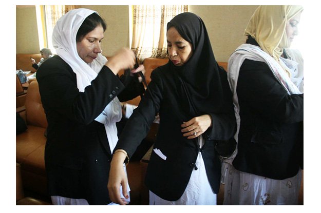 women lawyers tie black ribbons on arms during boycott of court proceedings to mark the anniversary of may 12 incident photo online