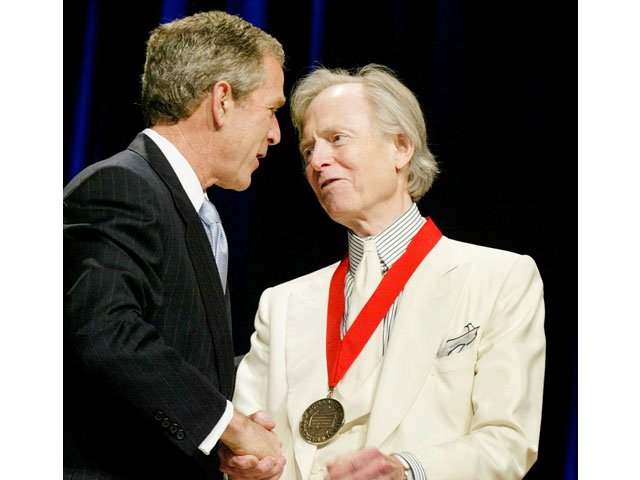 author tom wolfe stands with us president george w bush while receiving the national humanities medal in washington us april 22 2002 photo reuters