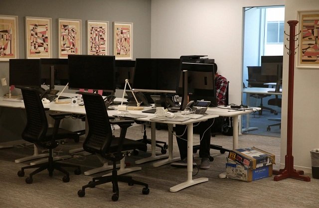 a person works on a laptop in the empty offices of cambridge analytica in washington dc us may 2 2018 photo reuters