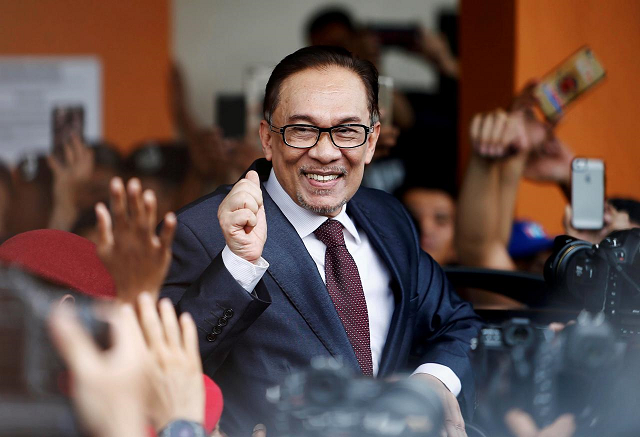 the pardon allows anwar to re enter active politics immediately photo reuters the pardon allows anwar to re enter active politics immediately photo reuters