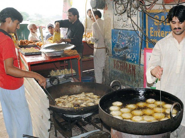 oily food items are being prepared for customers photo agha mehroz