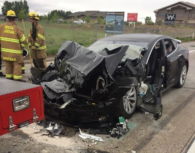 a tesla model s is seen after it hit the back of a mechanic truck from the unified fire authority in this traffic collision in south jordan utah us may 11 2018 photo reuters