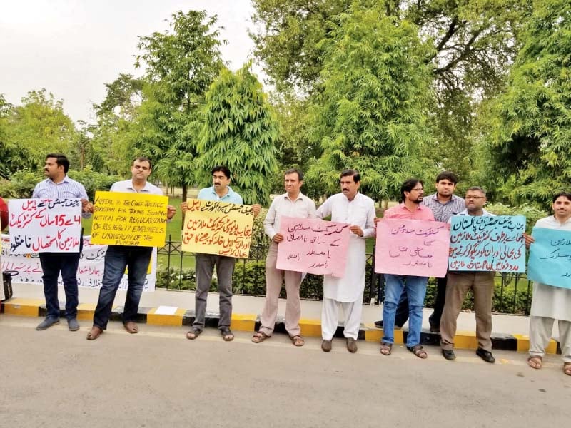 punjab university employees demand renewal of their contracts photo express