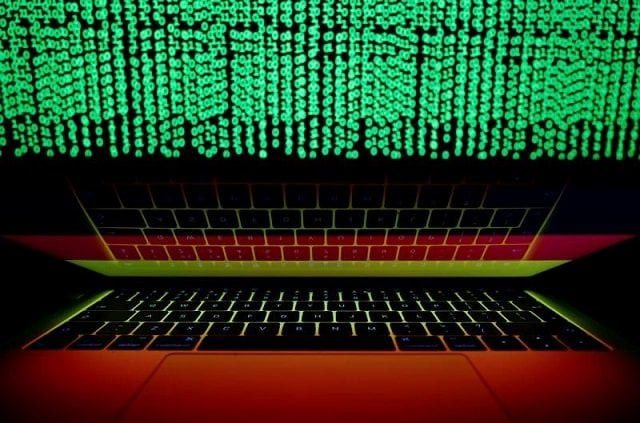 a german flag is seen on the laptop screen in front of a computer screen on which cyber code is displayed in this illustration picture taken march 2 2018 photo reuters a german flag is seen on the laptop screen in front of a computer screen on which cyber code is displayed in this illustration picture taken march 2 2018 photo reuters