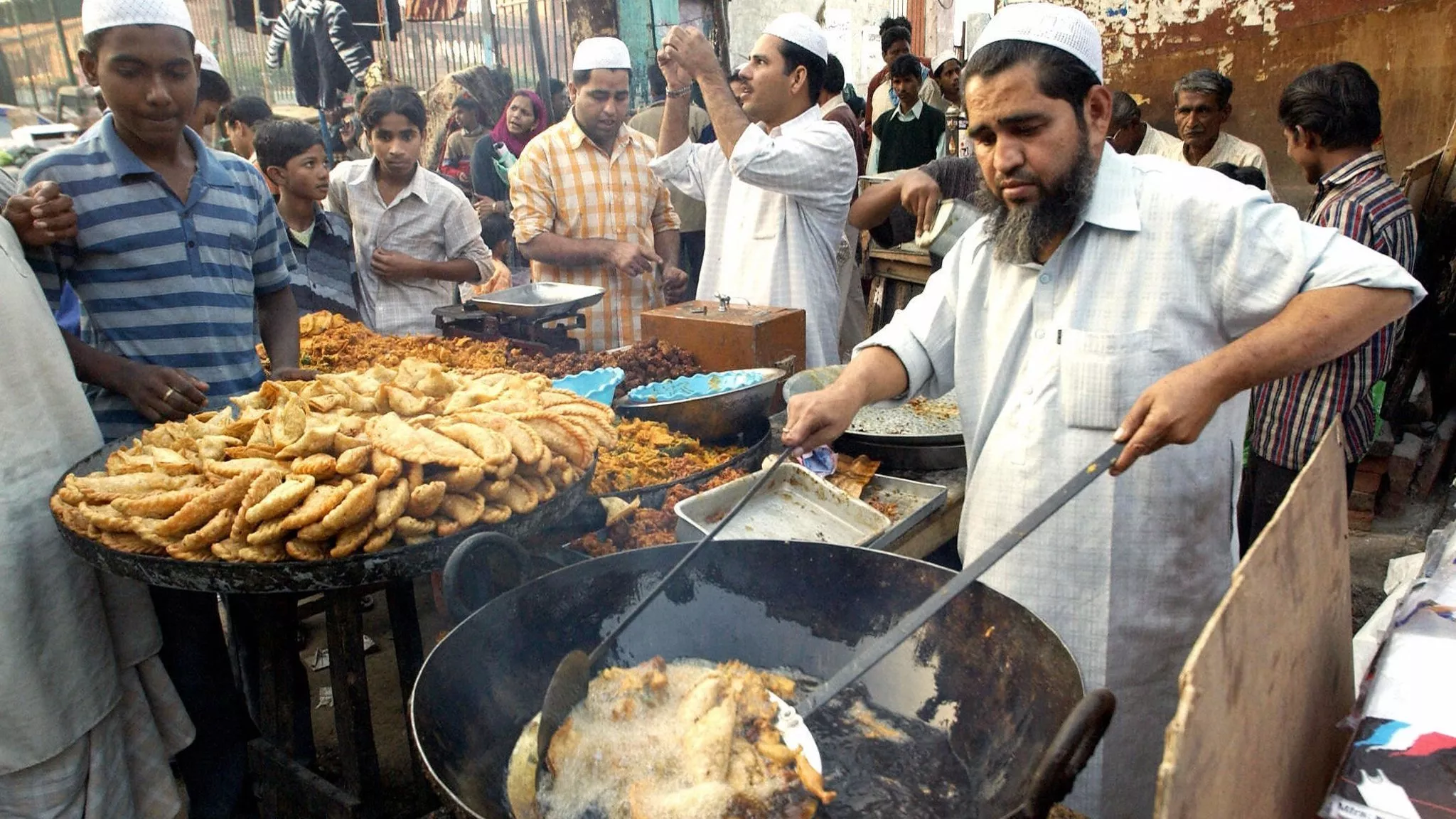 a food seller fries pakora photo afp a food seller fries pakora photo afp