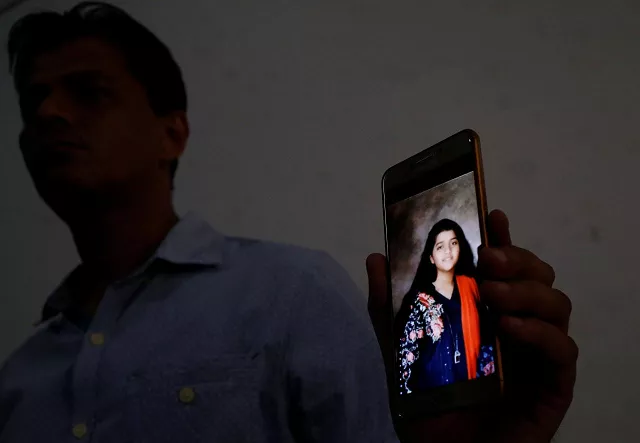 aziz shaikh father of sabika aziz sheikh a pakistani exchange student who was killed with others when a gunman attacked santa fe high school in santa fe texas us holds for media his mobile phone displaying photo of his daughter at his residence in karachi pakistan may 19 2018 photo reuters aziz shaikh father of sabika aziz sheikh a pakistani exchange student who was killed with others when a gunman attacked santa fe high school in santa fe texas us holds for media his mobile phone displaying photo of his daughter at his residence in karachi pakistan may 19 2018 photo reuters