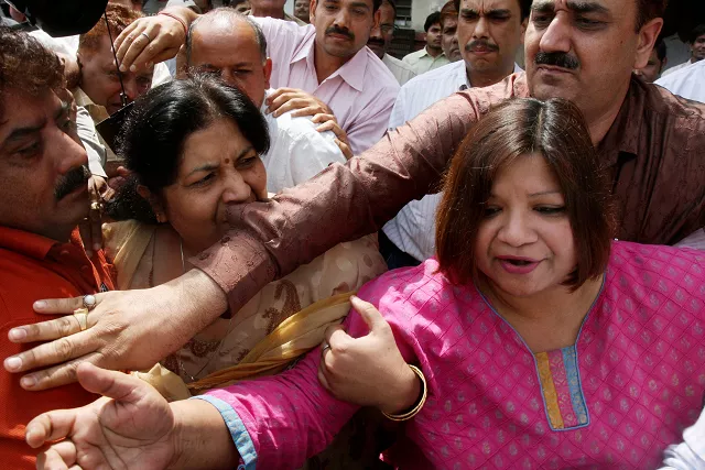 in this photograph taken on may 1 2010 indian foreign service ifs officer madhuri gupta r is escorted after making an appearance at the tis hazari court in new delhi photo afp in this photograph taken on may 1 2010 indian foreign service ifs officer madhuri gupta r is escorted after making an appearance at the tis hazari court in new delhi photo afp