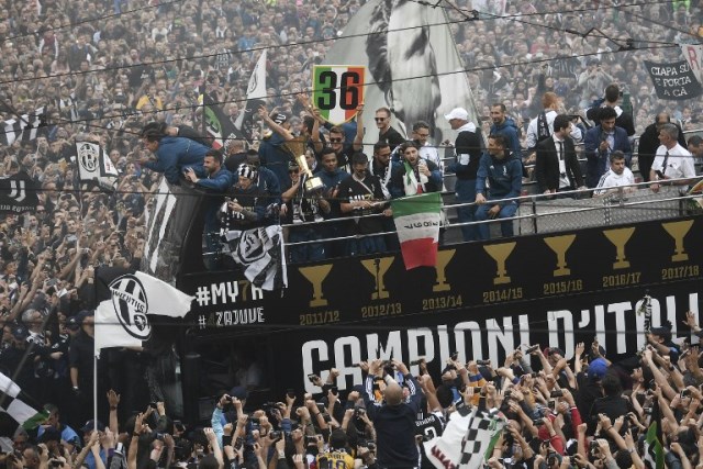 juventus were celebrating winning their seventh straight serie a title and fourth italian cup in a row with an open top bus parade through the streets of turin when the incident occured photo afp