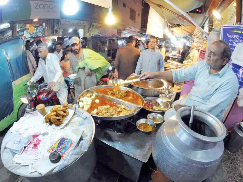 people buy siri paya and lassi at karatarpura food street photo agencies people buy siri paya and lassi at karatarpura food street photo agencies