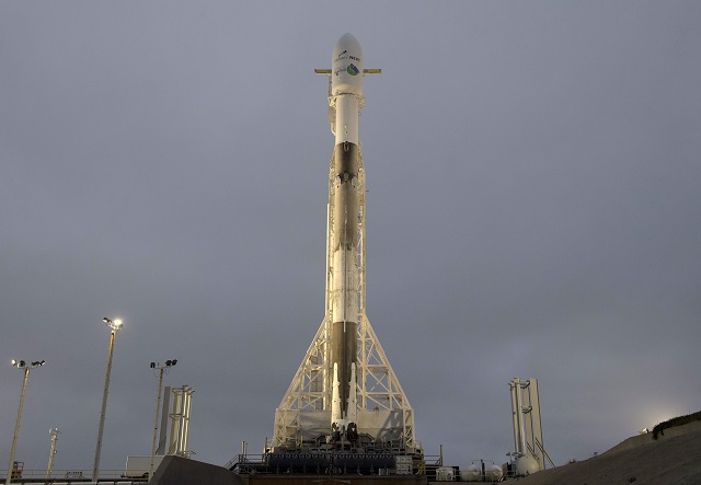 the spacex falcon 9 rocket is seen with the nasa german research centre for geosciences grace follow on spacecraft and onboard monday may 21 2018 at space launch complex 4e at vandenberg air force base in california the mission will measure changes in how mass is redistributed within and among earth 039 s atmosphere oceans land and ice sheets as well as within earth itself grace fo is sharing its ride to orbit with five iridium next communications satellites as part of a commercial rideshare agreement photo afp