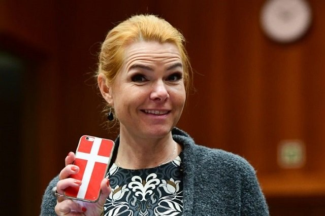 stojberg stoked controversy last year when she posted to facebook a photo of her smiling and holding a cake to celebrate denmark 039 s 50th measure for toughening immigration laws photo afp