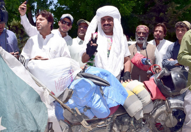 motorcyclist abdullah jan al noor makes a victory sign on his return to quetta photo express motorcyclist abdullah jan al noor makes a victory sign on his return to quetta photo express