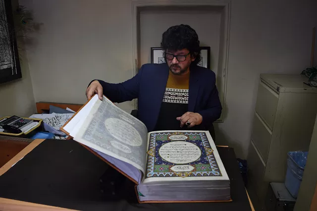 in this photograph taken on april 19 2018 afghan master miniature artist mohammad tamim sahibzada shows a handmade quran made with silk fabric at the turquoise mountain foundation in mourad khani in the old city section of kabul one of the only qurans ever made from silk fabric has been completed in afghanistan a feat its creators hope will help preserve the country 039 s centuries old tradition of calligraphy photo afp in this photograph taken on april 19 2018 afghan master miniature artist mohammad tamim sahibzada shows a handmade quran made with silk fabric at the turquoise mountain foundation in mourad khani in the old city section of kabul one of the only qurans ever made from silk fabric has been completed in afghanistan a feat its creators hope will help preserve the country 039 s centuries old tradition of calligraphy photo afp