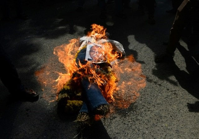 indian protesters stamp on an effigy of vedanta resources executive chairman anil agarwal during a protest in chennai photo afp
