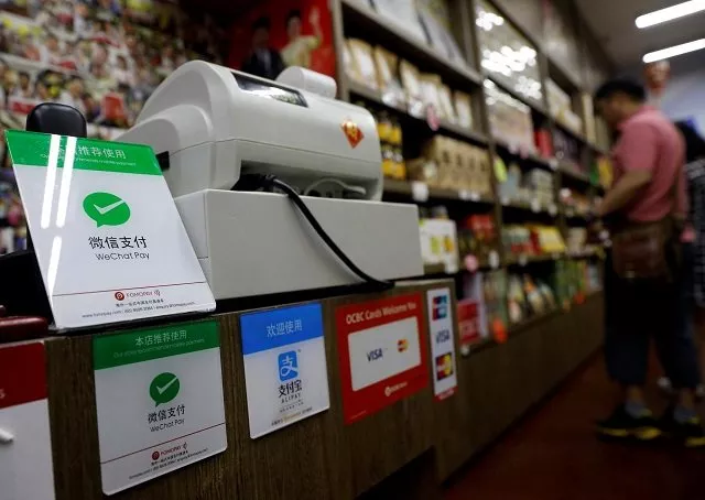 signs accepting wechat pay and alipay are displayed at a shop in singapore may 22 2018 picture taken may 22 2018 photo reuters signs accepting wechat pay and alipay are displayed at a shop in singapore may 22 2018 picture taken may 22 2018 photo reuters