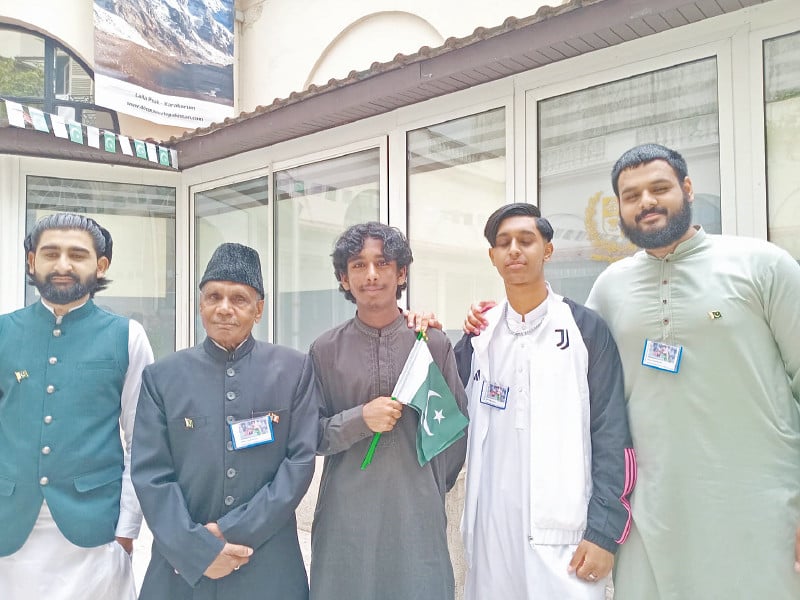 french pakistani national raja karamat ali and his grandsons display arshad nadeem s badges during the independence day celebrations in paris photo natasha raheel