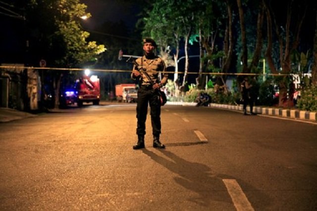 a policeman stands guard outside a church one of the three hit by suicide bombers in surabaya indonesia may 13 2018 picture taken may 13 2018 photo reuters