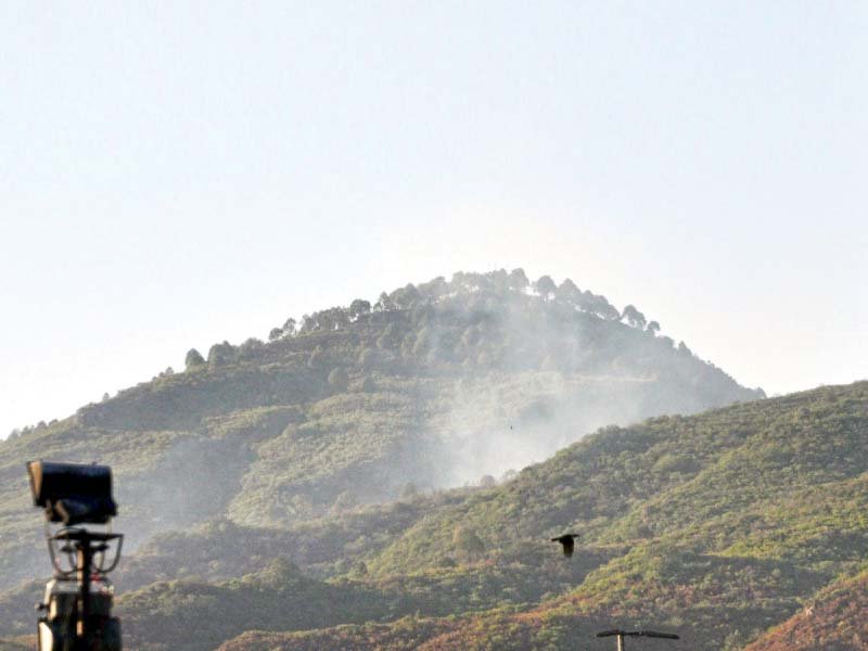 somke rises from margalla hills where widlfire broke out at different places photo express
