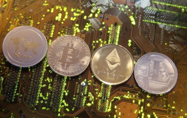 representations of the ripple bitcoin etherum and litecoin virtual currencies are seen on a pc motherboard in this illustration picture february 13 2018 photo reuters