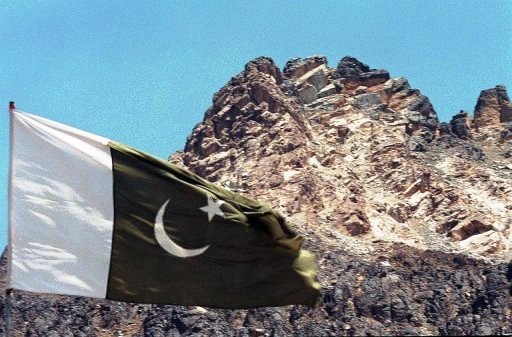 pakistan 039 s national flag flies near the hill under which the country 039 s five nuclear tests were carried out photo afp