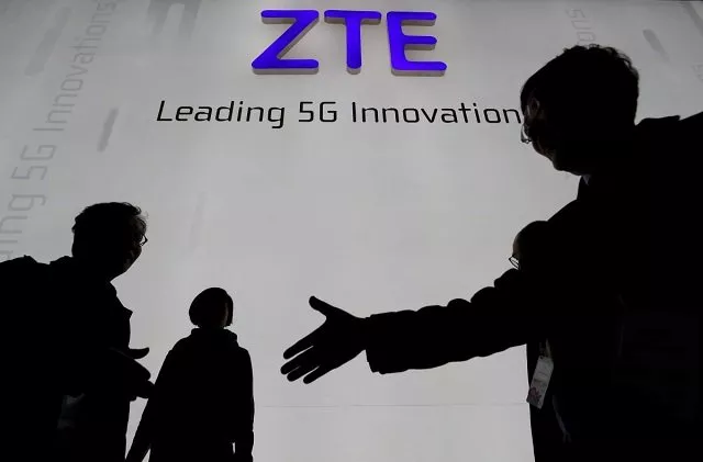 visitors pass in front of the chinese telecoms equipment group zte booth at the mobile world congress in barcelona spain february 26 2018 photo reuters visitors pass in front of the chinese telecoms equipment group zte booth at the mobile world congress in barcelona spain february 26 2018 photo reuters