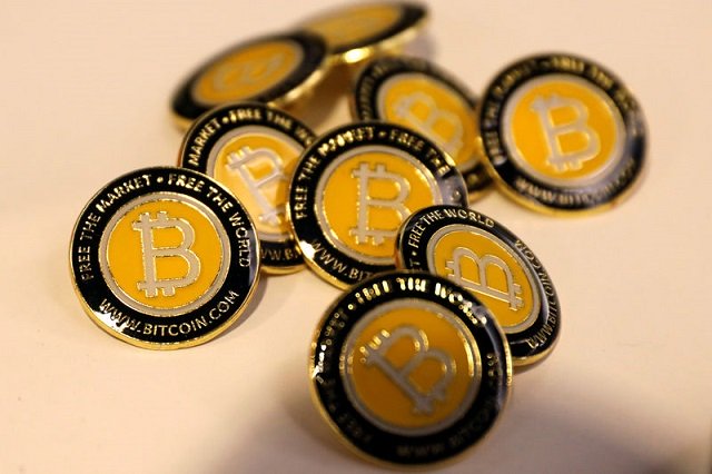 bitcoin com buttons are seen displayed on the floor of the consensus 2018 blockchain technology conference in new york city new york us may 16 2018 photo reuters