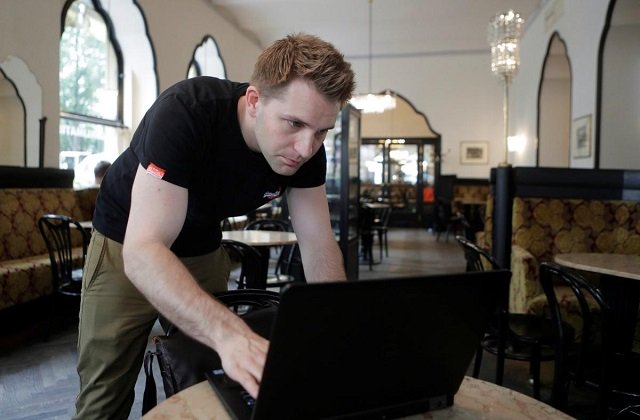 austrian lawyer and privacy activist max schrems prepares his laptop during a reuters interview in a cafe in vienna austria may 22 2018 photo reuters